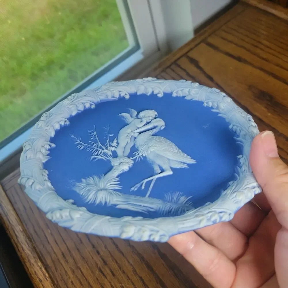 Schafer & Vater Blue & White Jasperware Plaque Featuring a Cherub & Stork Lily